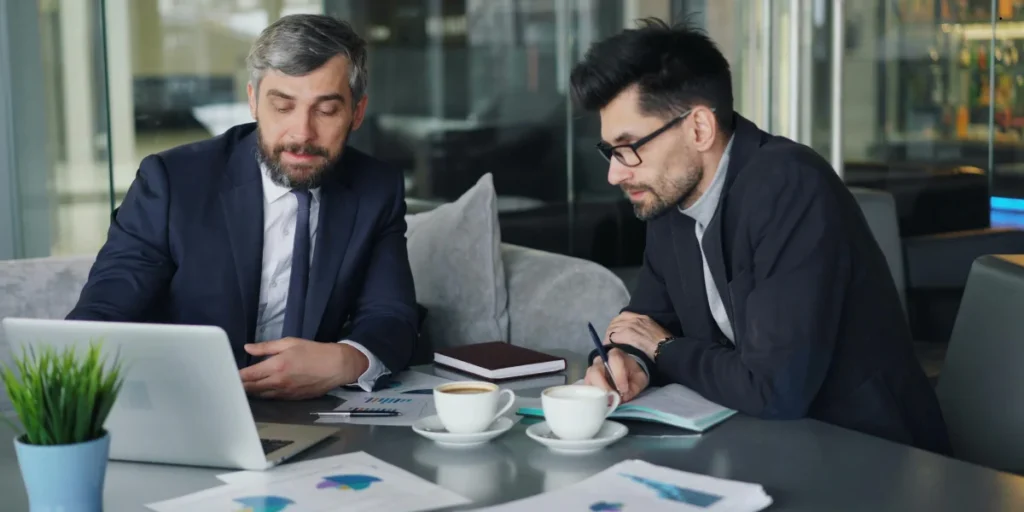 businessmen discussing investments